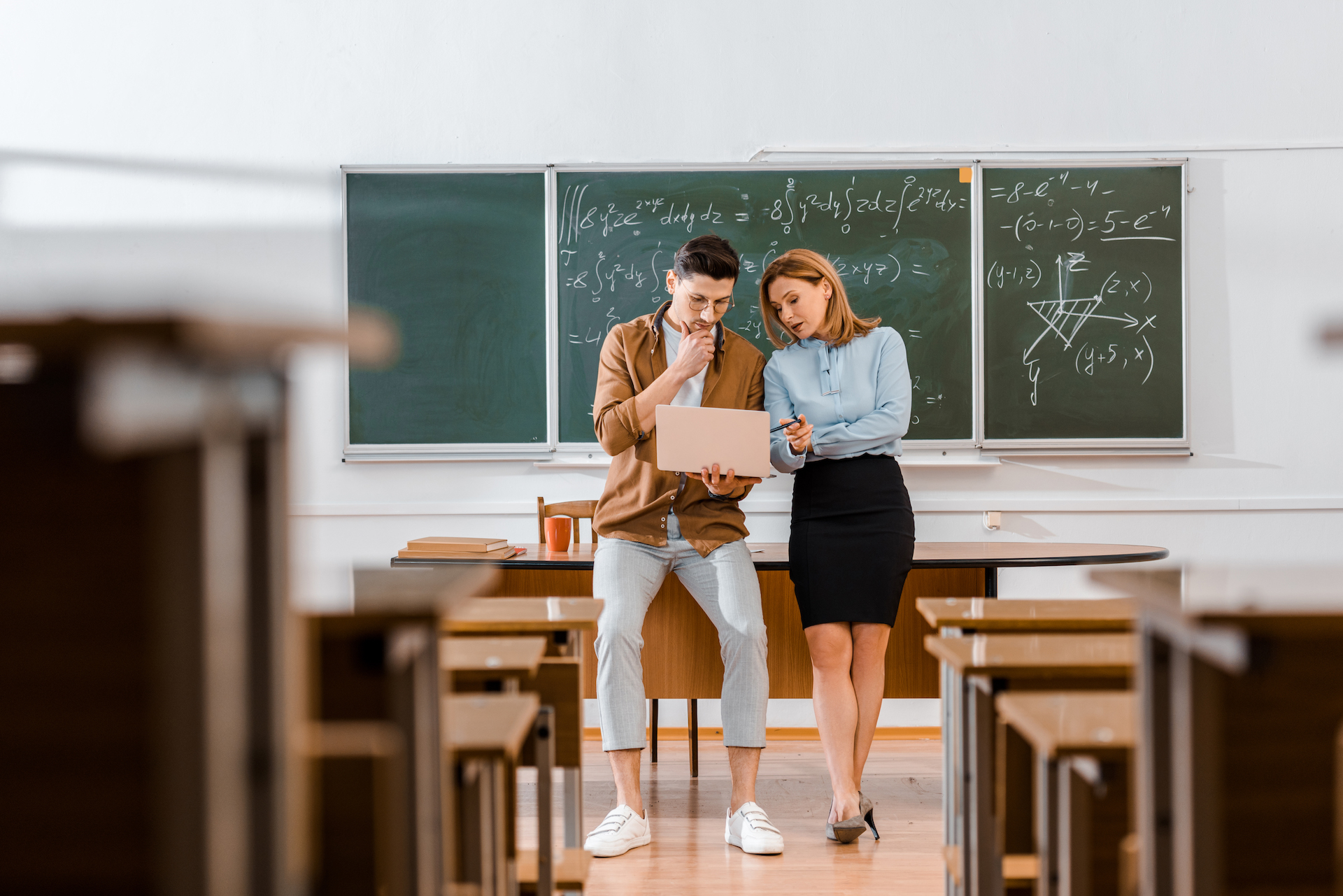 Teachers in classroom discussing