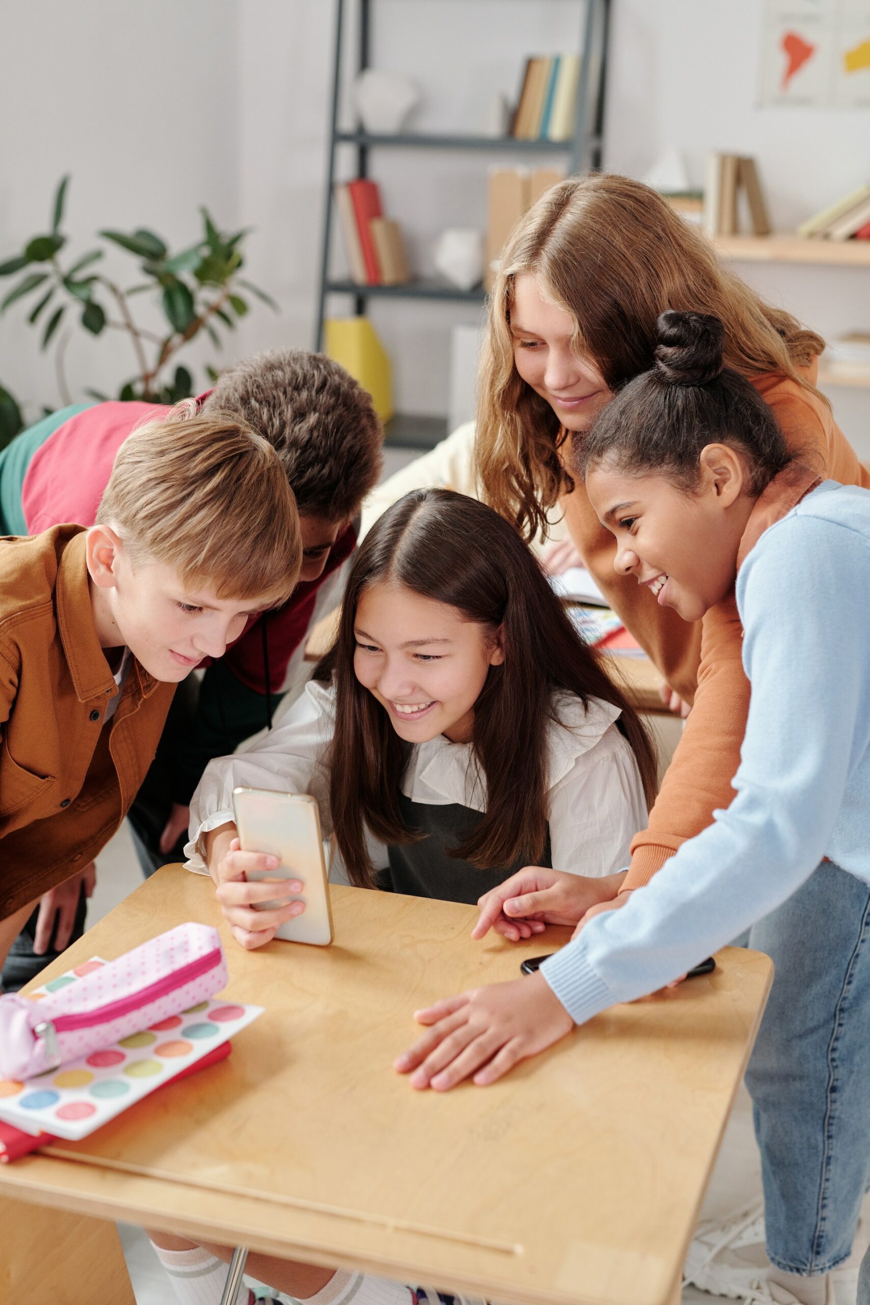 Happy students using smartphone