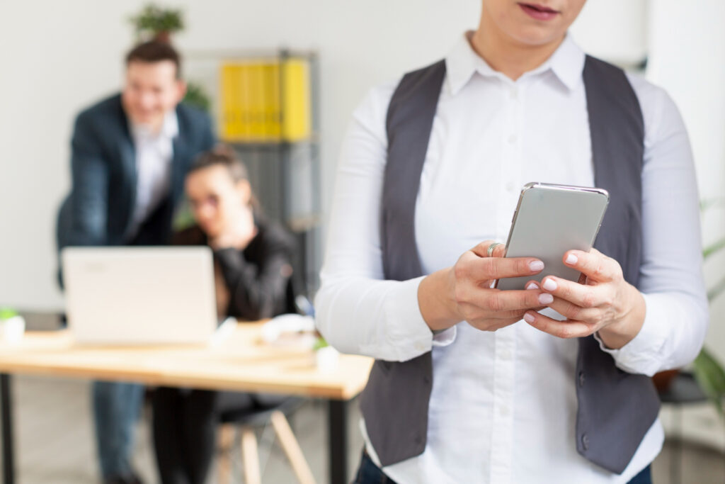 Female Teacher Using Mobile Phone