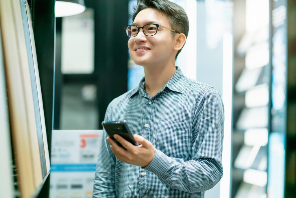 male teacher using mobile phone